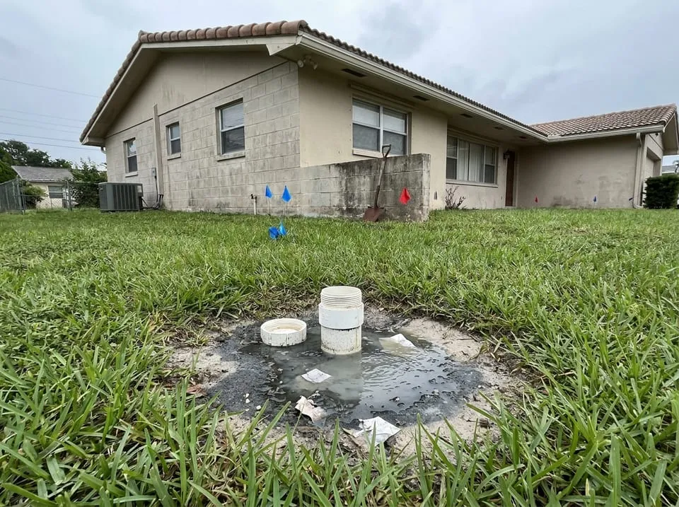 Sewage surfacing from a yard cleanout on a Florida lawn, the backup that calls for emergency sewer repair